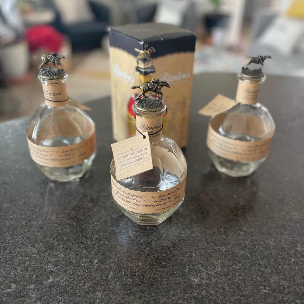 Blanton’s Whiskey Collectible Bottles along with one box.